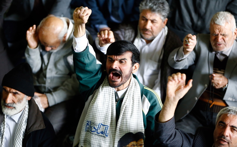 Iranian men shout anti-U.S. slogans after Friday prayers in Tehran, Iran, April 7, following U.S. missile strikes in Syria. (CNS/Abedin Taherkenareh, EPA)