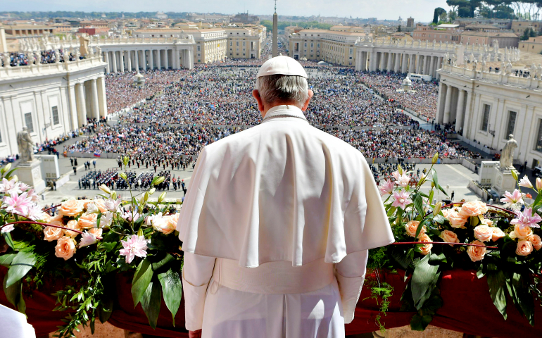 Pope Francis delivers his Easter message and blessing "urbi et orbi" (to the city and the world) from the central balcony of St. Peter's Basilica at the Vatican April 16. (CNS/L'Osservatore Romano)