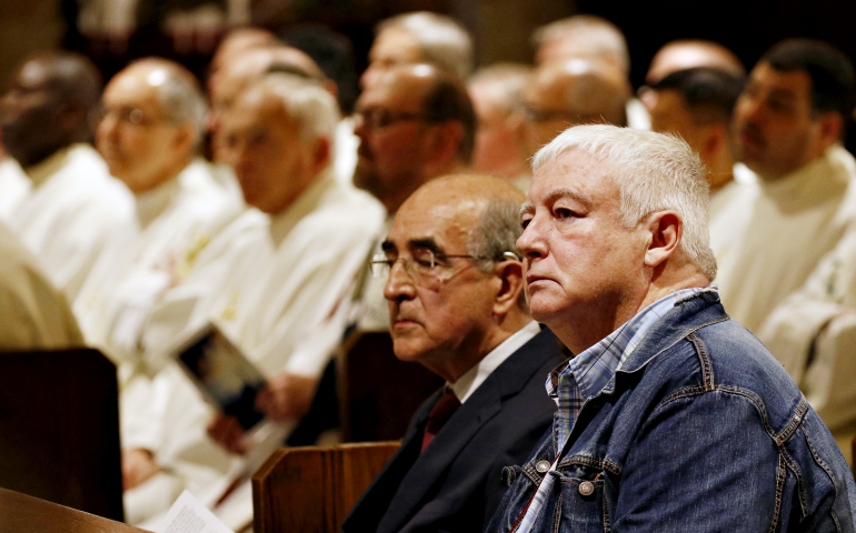 Michael Gilbride, right, a survivor of clergy sex abuse, listens to the first reading during a Mass of Hope and Healing for victims of sex abuse April 26 at St. Anselm Church in Brooklyn, New York. (CNS/Gregory A. Shemitz)