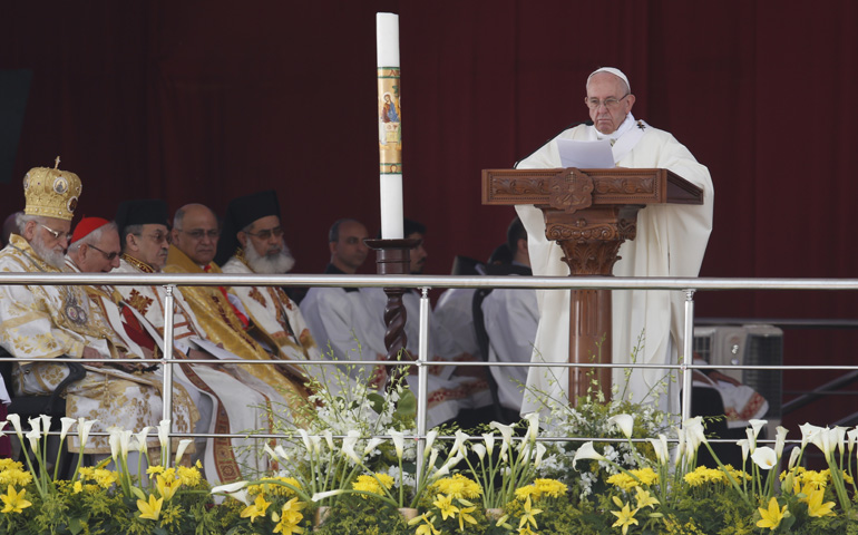 Pope Francis gives the homily as he celebrates Mass at the Air Defense Stadium in Cairo April 29. (CNS/Paul Haring)