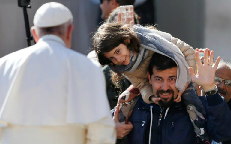 Pope Francis greets people during his general audience in St. Peter's Square at the Vatican May 3. (CNS photo/Paul Haring)