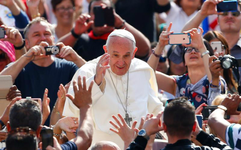 Pope Francis waves as he arrives to lead his general audience in St. Peter's Square May 10 at the Vatican. (CNS/Tony Gentile, Reuters) 