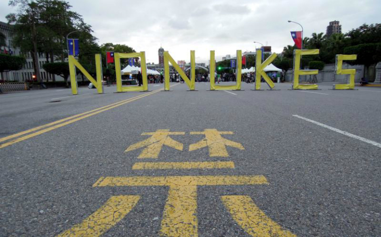 A sign with the words NO NUKES is seen in front of the Presidential Office Building during an anti-nuclear protest March 3 in Taipei, Taiwan. (CNS/Henry Lin, EPA)