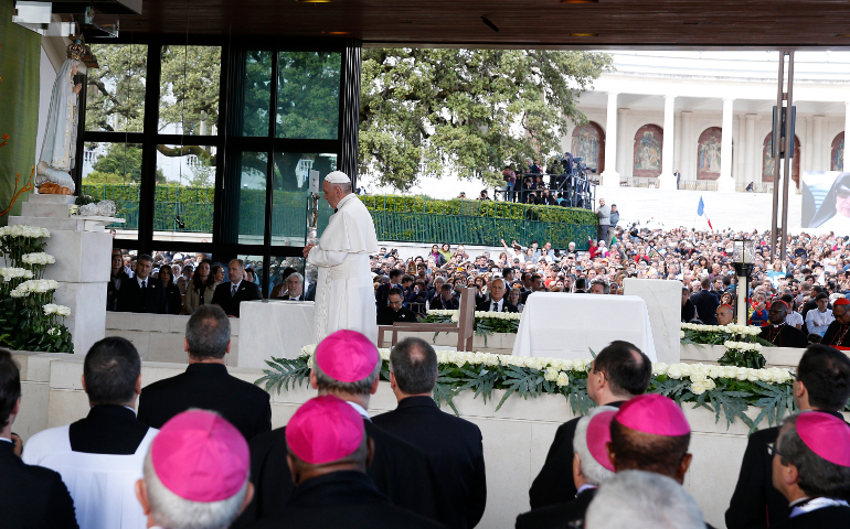 Pope Francis visits the Little Chapel of the Apparitions at the Shrine of Our Lady of Fatima in Portugal, May 12. The pope was making a two-day visit to Fatima to commemorate the 100th anniversary of the Marian apparitions and to canonize two of the young seers. (CNS/Paul Haring)
