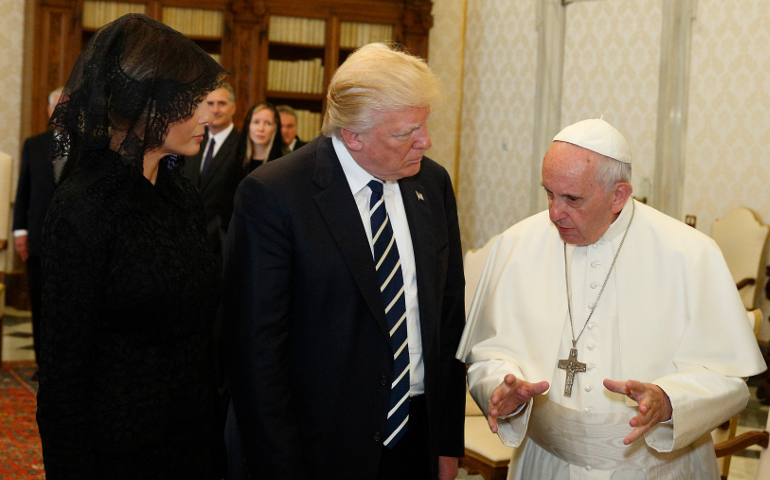 Pope Francis talks with U.S. President Donald Trump, accompanied by his wife, Melania, left, during a private audience at the Vatican May 24. (CNS photo/Paul Haring)
