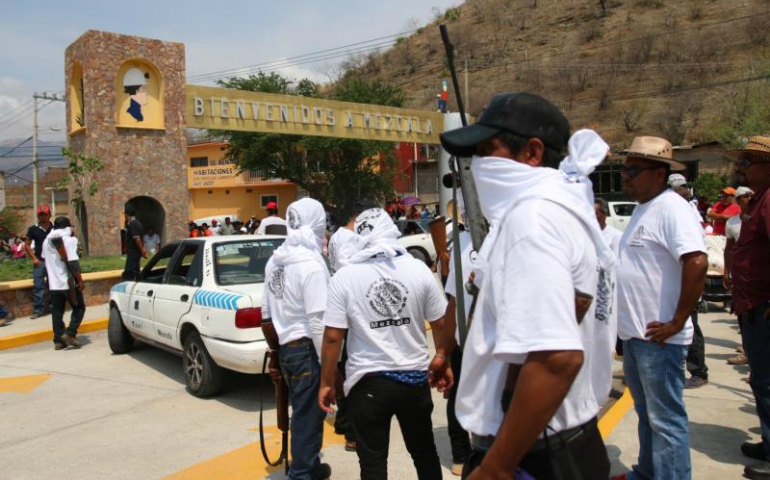 A group of armed civilians is seen May 28 in the southern Mexican state of Guerrero. (CNS/Jose Luis de la Cruz, EPA) 
