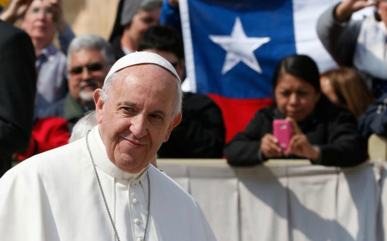 Chile's national flag is seen as Pope Francis leads his general audience in St. Peter's Square at the Vatican April 5. (CNS/Paul Haring)