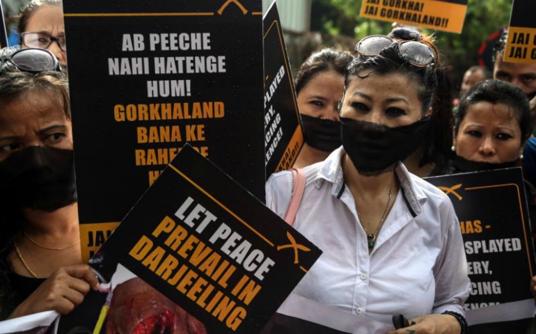 Protesters supporting ethnic Gorkha people carry signs and shout slogans during a June 22 demonstration in Mumbai, India. (CNS/Divyakant Solanki, EPA)