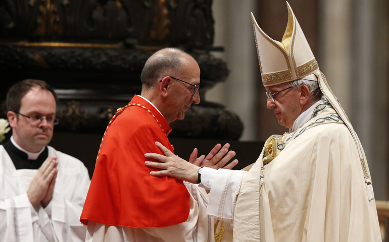 Pope Francis embraces Cardinal Juan Omella of Barcelona, Spain, as the pontiff leads a consistory in St. Peter's Basilica at the Vatican June 28. (CNS/Paul Haring)