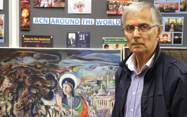 Farid Georges, a Syriac Christian from Homs, Syria, poses for a photo in England June 23. His artwork depicting Syria's six-year war is being shown in Catholic cathedrals of northwest England and Wales. (CNS/Simon Caldwell) 