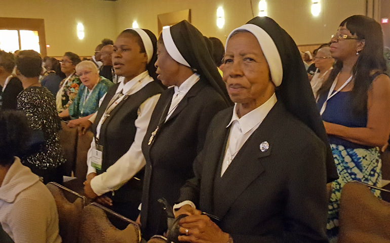 Attendees participate in the closing Mass of the 12th National Black Catholic Congress on Sunday, July 9, at the Hyatt Regency Hotel in Orlando, Florida. (NCR photo/Gail DeGeorge)