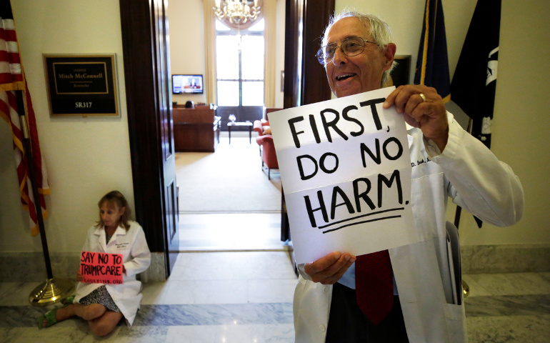 Health care activists protest the Republican health care bill at the Russell Senate Office Building in Washington July 17. The bill collapsed in the Senate later that day after two more GOP senators said they couldn't support it. (CNS/Yuri Gripas, Reuters) 