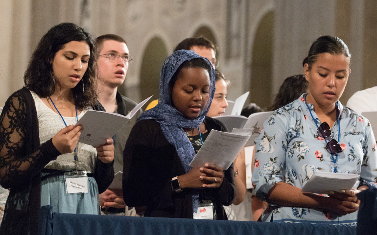 Young people pray at the Basilica of the National Shrine of the Immaculate Conception in Washington July 22. (CNS/courtesy Daphne Stubbolo, Archdiocese of Washington)