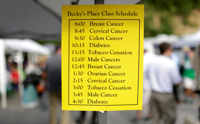 A sign for health care classes is seen posted July 21 at the Remote Area Medical Clinic in Wise, Va. (CNS/Joshua Roberts, Reuters)