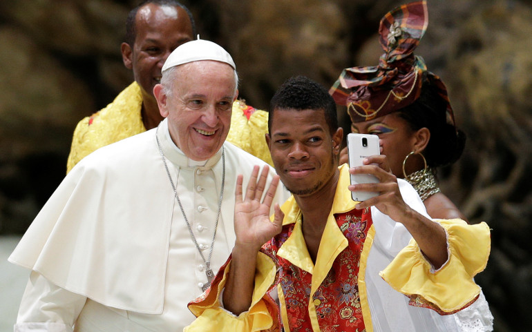 A man takes a selfie with Pope Francis during his weekly audience in Paul VI hall Aug. 2 at the Vatican. (CNS/Max Rossi, Reuters) 
