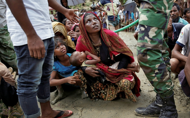 Rohingya refugees wait to receive aid Sept. 27, 2017, at a camp in Cox's Bazar, Bangladesh. (CNS/Reuters/Cathal McNaughton)