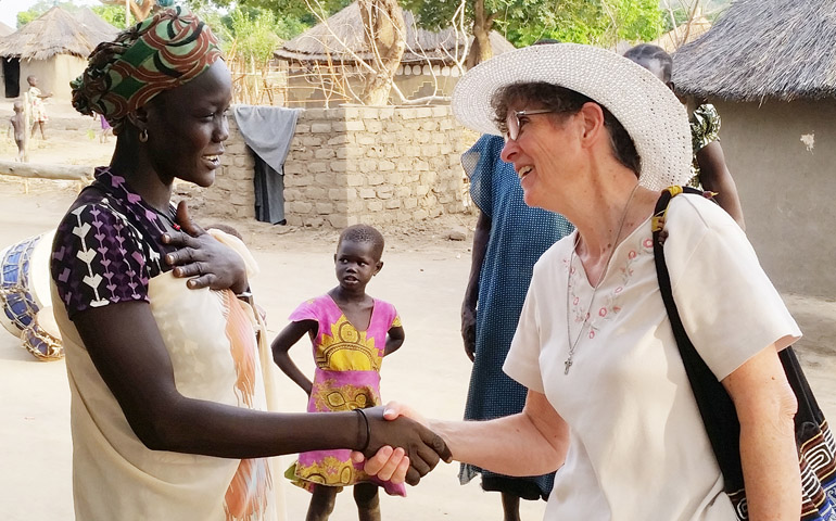 Mercy Sr. Marilyn Lacey greets a South Sudanese refugee at a refugee camp in northern Uganda in January 2018. (CNS/Courtesy of Sr. Marilyn Lacey)