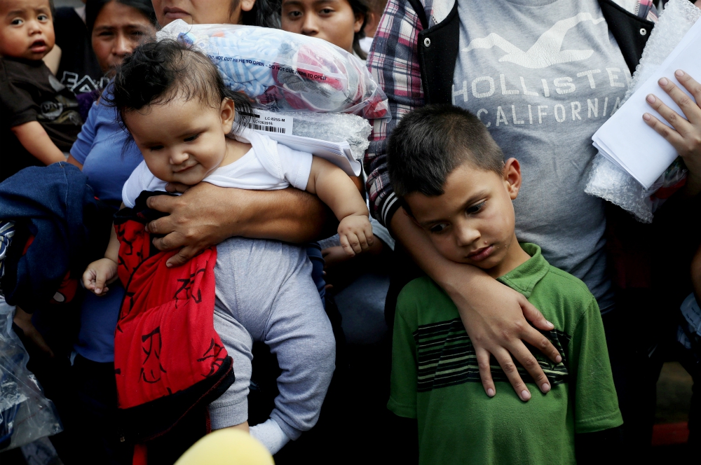 Immigrant children are seen at a bus depot June 22, 2018, in McAllen, Texas. Sisters volunteering at the border are doing "real, on the ground, Gospel, at-the-periphery work," says St. Joseph Sr. Carol Zinn. "The situation is pretty dire." (CNS/Reuters/Loren Elliott)