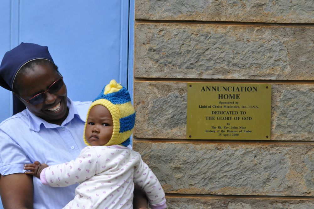 Sr. Margaret Wangeci holds a child belonging to one of the young mothers who has found shelter at the home. The sisters arrange to have the baby taken care of during the day while the mother attends school. (Lourine Oluoch)