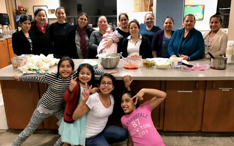Sacred Heart Parish's Encuentro group, including Rocio Campos (fourth from left in the back), poses for a photo before serving the homeless in Lacey, Washington. (Provided photo)