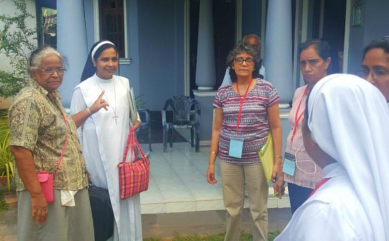 The church healing mission team does a quick evaluation before moving to another family affected by the bombings on Easter Sunday in Negombo, Sri Lanka. (Thomas Scaria)