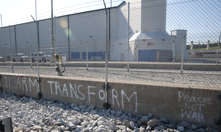 Slogans are shown painted on an embankment outside the Highly Enriched Uranium Materials Facility in Oak Ridge, Tenn., following a break-in by activists July 28. (U.S. government)