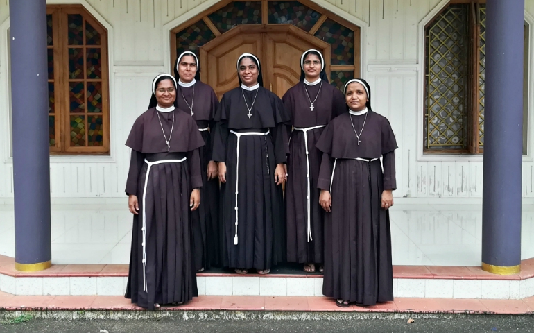 The five Members of the Missionaries of Jesus who in September staged a sit-in in Kochi, Kerala, India, to demand the arrest of a bishop accused of rape. From left are Sisters Anupama, Alphy, Ancitta, Neena Rose and Josephine, standing in front of their convent chapel at Kuravilangad. (Saji Thomas)