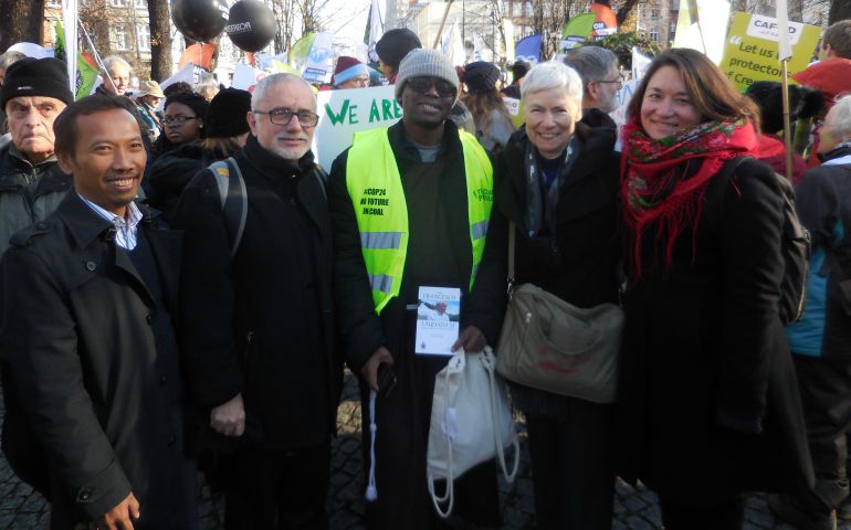 Sr. Sheila Kinsey, second from right, takes part in a rally Dec. 8 during COP24, the annual United Nations climate summit. Also pictured are, from left, Budi Tjahjono of Franciscans International, Franciscan Br. Rodrigo Peret, Capuchin Br. Benedict Ayodi and Josianni Gauthier, Secretary General of CIDSE, the Catholic development network. (Provided photo)