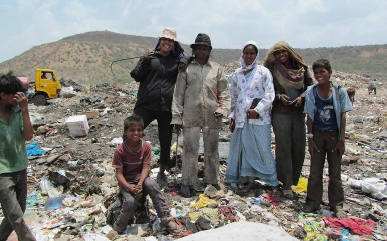 Sr. Sushila Toppo, third from right, visists with some waste pickers at the Indore landfill. To her right is Pinki Goswami. (GSR/Saji Thomas)