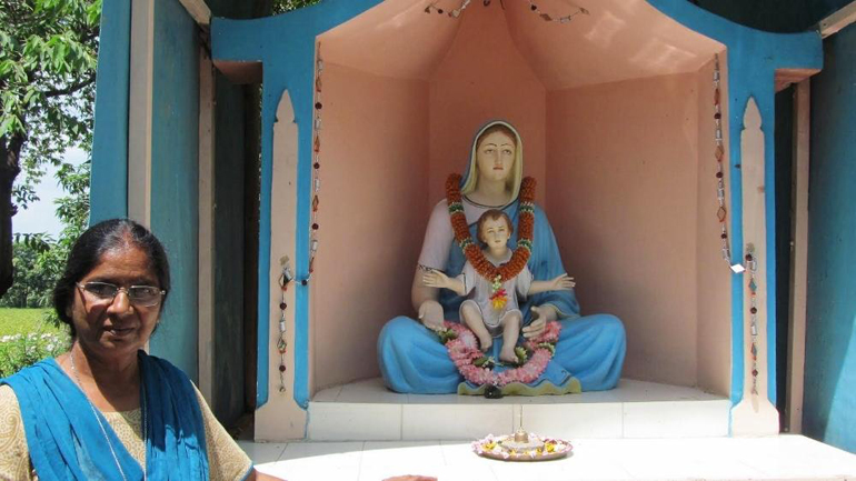 Sr. Pushpanjali Paul stands near a Marian grotto installed on her Sadhana Sanchar campus on the outskirts of Bhopal, Central Indian state of Madhya Pradesh. (Provided photo)