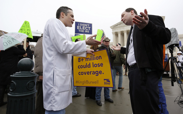 Dr. Devon Fagel, a physician and cancer survivor, argues in favor of the Affordable Care Act with Phil Kerpen, who was part of a Tea Party Patriots demonstration against the health care law March 4 outside the U.S. Supreme Court building in Washington. (CNS/Reuters/Jonathan Ernst)