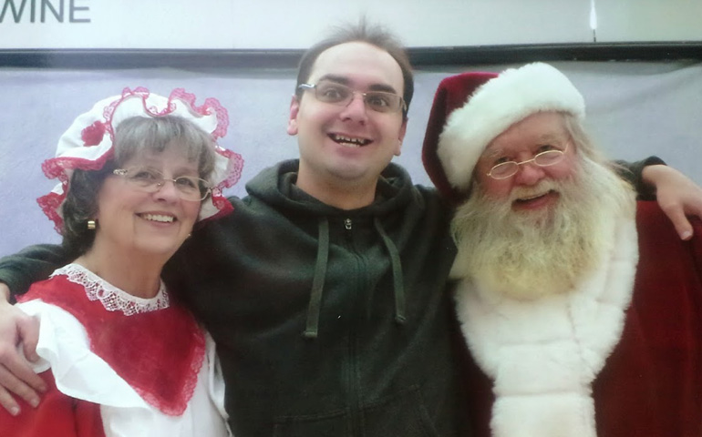 The author's son Nick, with Santa and Mrs. Claus in a 2014 photo.
