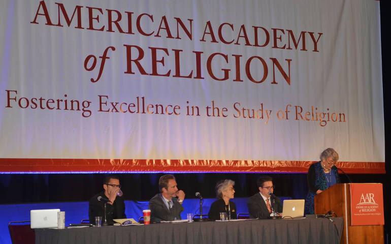 Panelists discuss the findings of a Public Religion Research Institute/American Academy of Religion survey on climate change Nov. 22 at the annual meeting of the American Academy of Religion and the Society of Biblical Literature, in San Diego. (Rosemary Johnston)