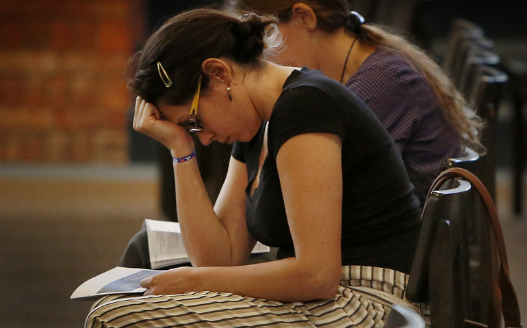 Mariana Hernandez prays during an Aug. 22 prayer service for repentance and healing for clergy sexual abuse at Our Lady of the Brook in Northbrook, Illinois. (CNS / Chicago Catholic / Karen Callaway)