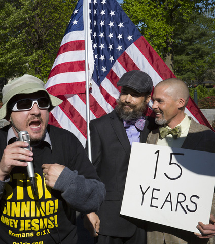 A man opposing same-sex marriage joins other advocates Tuesday outside the U.S. Supreme Court in Washington while a couple stands behind him. (CNS/Tyler Orsburn) 