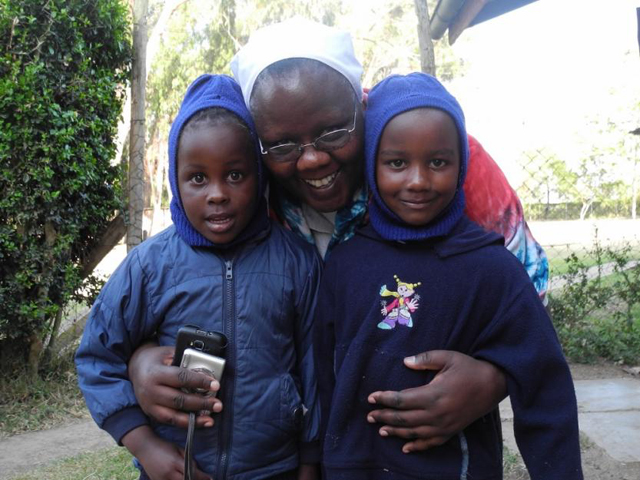 Sr. Agnes Wamuyu Ngure poses with two of her nieces in Naromuru, Kenya. (GSR/Melanie Lidman)