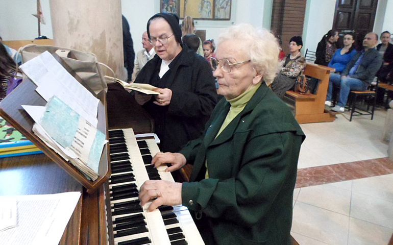 Maria Dhimitri plays the organ April 21 at Sacred Heart Catholic Church in Tirana, Albania. (CNS/James Martone)