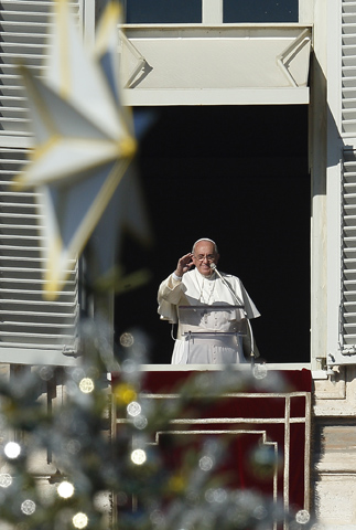 Pope Francis leads his Angelus on Sunday from the window of his studio overlooking the square at the Vatican. (CNS/Paul Haring) 