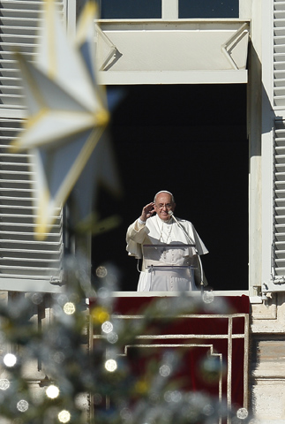 Pope Francis leads his Angelus on Sunday from the window of his studio overlooking the square at the Vatican. (CNS/Paul Haring)