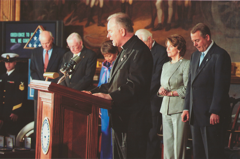 Jesuit Fr. Pat Conroy gives the Apollo 11 invocation.