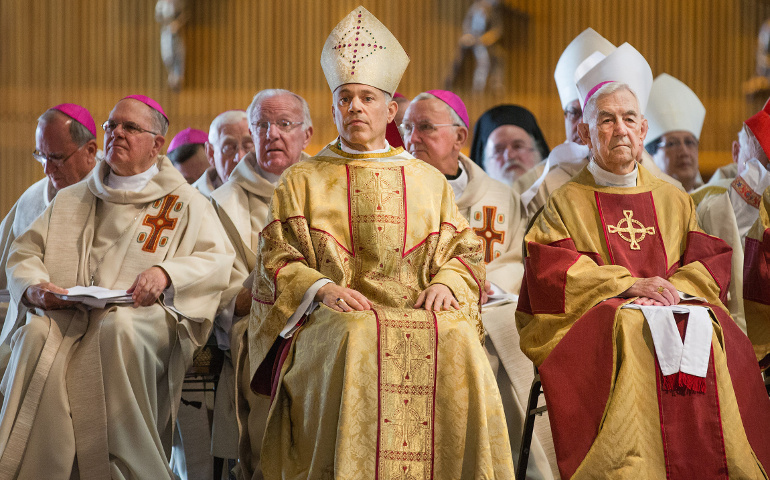 Archbishop Salvatore J. Cordileone, center, and retired Archbishop John R. Quinn of San Francisco, right, look on during Cordileone's installation Mass at the Cathedral of St. Mary of the Assumption  on Thursday. He succeeds Archbishop George H. Niederauer, 76, who had headed the San Francisco Archdiocese since 2005. (CNS/Catholic San Francisco/Dennis Callahan)