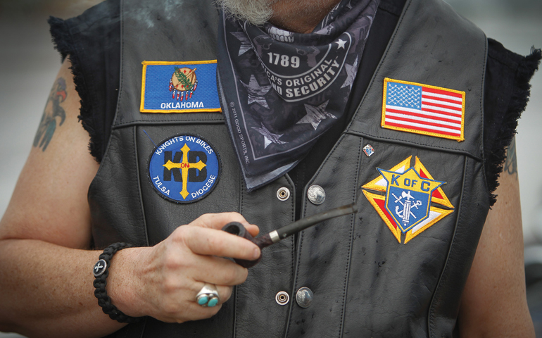 Charlie Hoy, a member of the Knights on Bikes from the diocese of Tulsa, Okla., displays patches on his vest in Tulsa in May. (CNS/Eastern Oklahoma Catholic/Dave Crenshaw)  