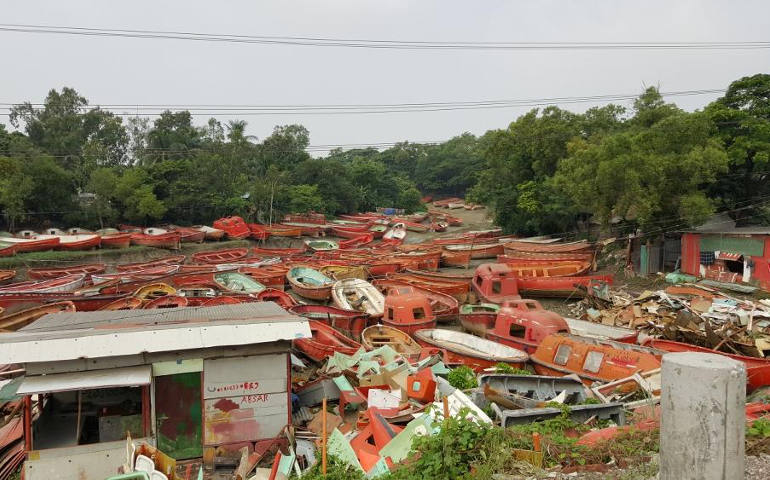 Old fishing boats and other crafts are piled up outside the coastal city of Chittagong, Bangladesh. Floods and other water-related problems are common in this coastal city, and one of the city's industries is the demolition of old ships and boats. (GSR photo / Chris Herlinger)