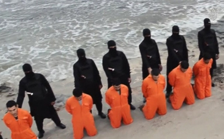 This still image from an undated video made available on social media Feb. 15 reportedly shows the 21 Egyptian Christians kidnapped in Libya before they were beheaded. (CNS/Reuters)