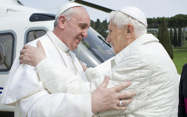 Pope Francis embraces emeritus Pope Benedict XVI on March 23 at the papal summer residence in Castel Gandolfo, Italy. (CNS/Reuters/L'Oss ervatore Romano)