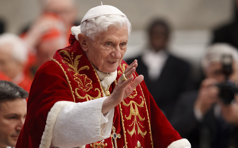 Pope Benedict XVI greets the crowd as the arrives to make remarks at the end of a Mass for the Knights of Malta in St. Peter's Basilica on Saturday at the Vatican. (CNS/Paul Haring)