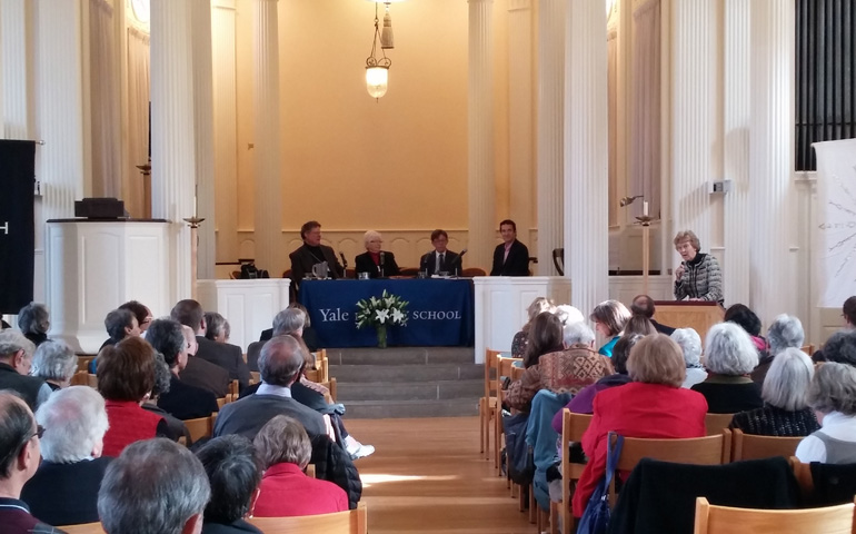 Mary Evelyn Tucker, at podium, opens a panel on Earth jurisprudence at the Nov. 7-9 conference "Living Cosmology: Christian Responses to 'Journey of the Universe' " in New Haven, Conn. Panelists included, from left: Paul Waldau, Patricia Siemen, Brian Brown, and Doug Kysar (Imogene Drummond)