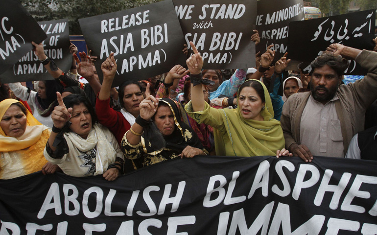 Protesters hold up placards demanding the release of Asia Bibi, a Pakistani Christian woman who has been sentenced to death for blasphemy, at a 2010 rally in Lahore. (CNS/Reuters/Mohsin Raza)