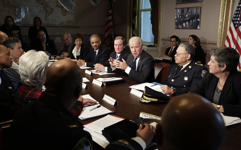 U.S. Vice President Joe Biden, center, gives a statement to the media before convening a meeting on gun violence with law enforcement leaders and White House officials at the White House Dec. 20 in Washington. (CNS/Reuters/Chris Kleponis)
