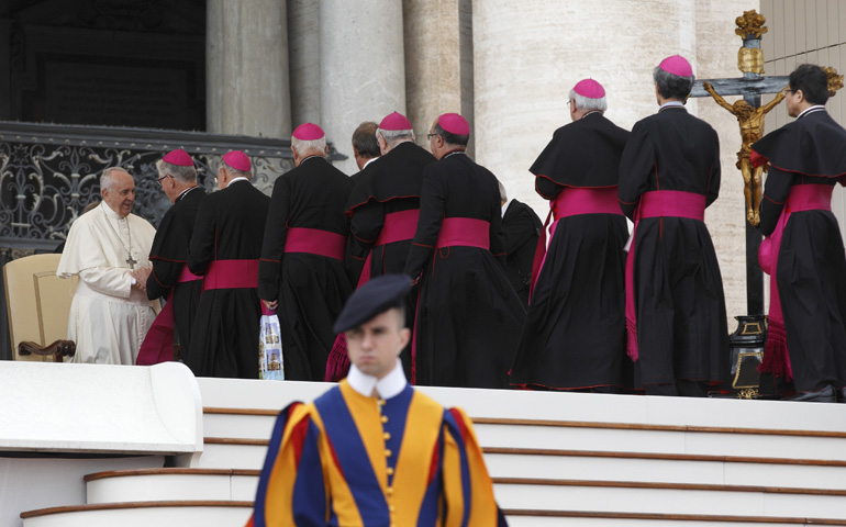 Pope Francis greets bishops at his Oct. 22 general audience in St. Peter's Square at the Vatican. (CNS/Paul Haring)
